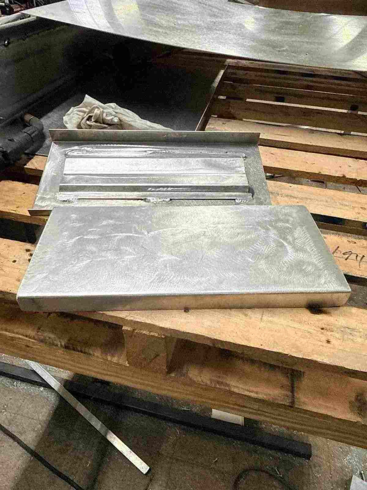 Aluminum dry box hatch lid and welded pan fabricated at JG's Custom Fabrication shop in Bunkie, Louisiana