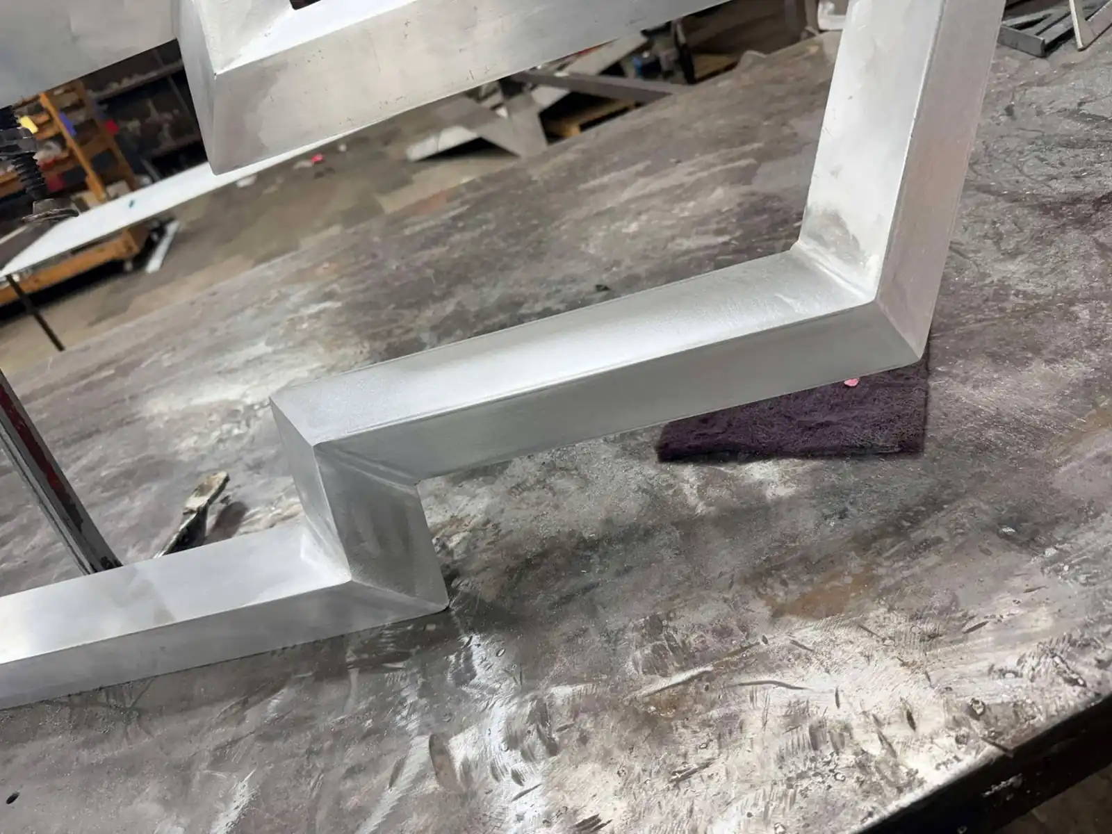 Ground and polished corner weld on an aluminum sign return built at JG's in Bunkie, Louisiana