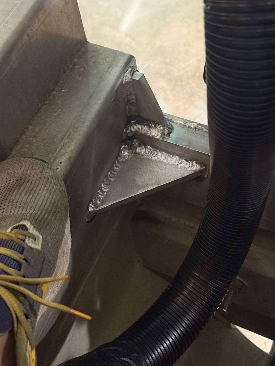 Close-up of an aluminum gusset brace weld detail on a frame in Bunkie, Louisiana
