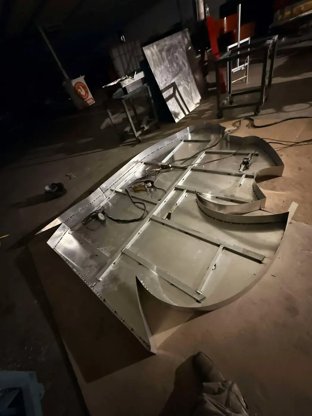 Oversized aluminum sign letter pan with internal bracing and LED wiring laid out during fabrication