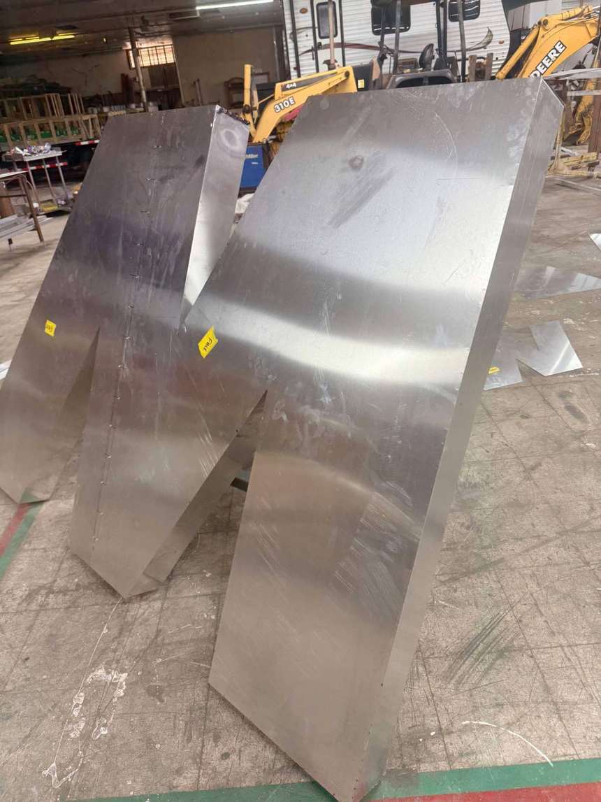 Aluminum dimensional sign letters staged in the fabrication shop in Bunkie, Louisiana