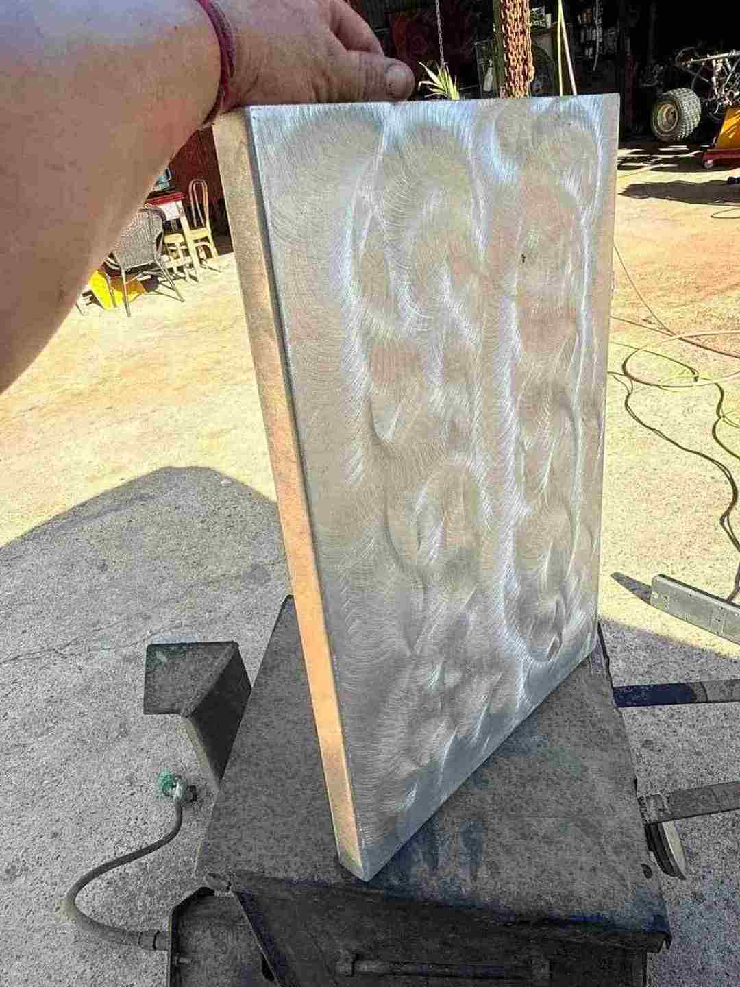 Brushed aluminum hatch lid with swirl-finished face fabricated for a boat mod in Bunkie, Louisiana